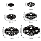 Custom metal cabin sign featuring bear, moose, maple leaf and personalized family name, laser-cut from powder-coated steel