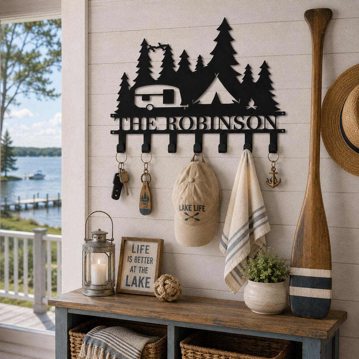 Custom camping key holder displayed in a lake house entryway with keys, a sun hat, and a lightweight towel.