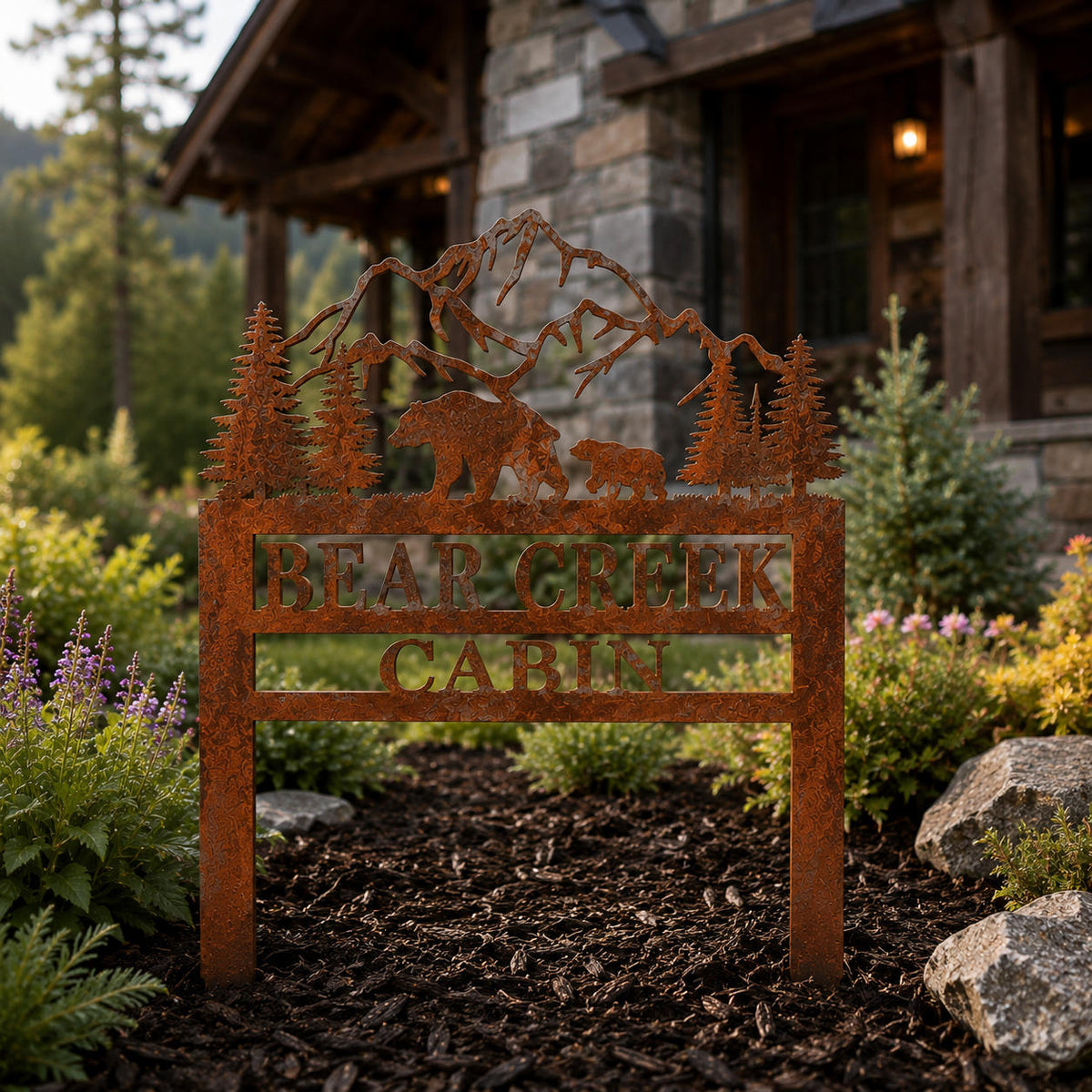 Personalized corten steel bear mountain cabin sign installed in front of a rustic mountain lodge