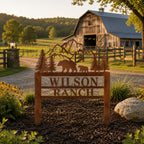 Rust patina corten steel ranch entrance sign with mountain and bear silhouette at farmhouse driveway