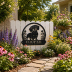 Personalized dachshund metal sign decorating a colorful backyard flower garden.