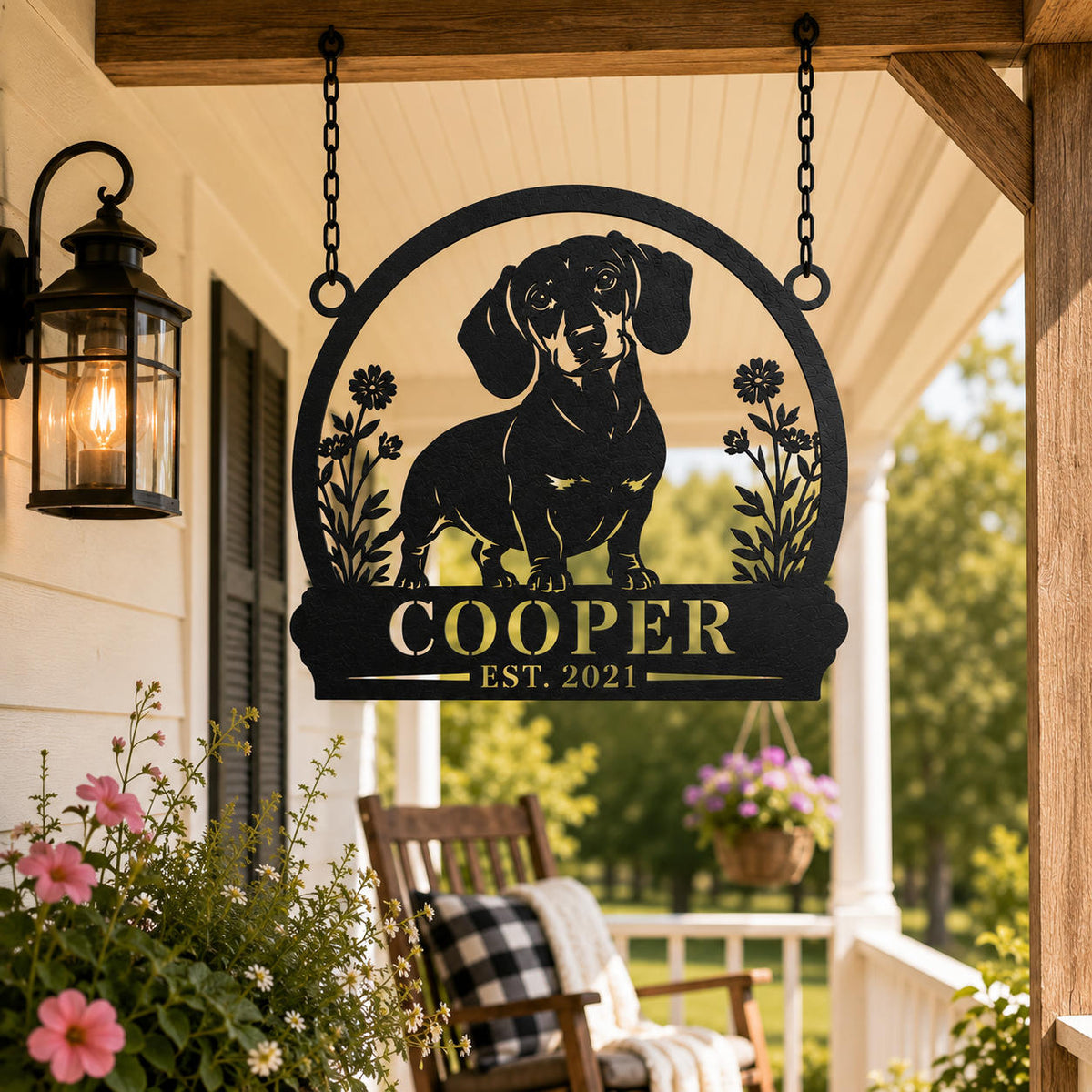 Custom dachshund metal hanging sign suspended by chains on a rustic farmhouse porch.
