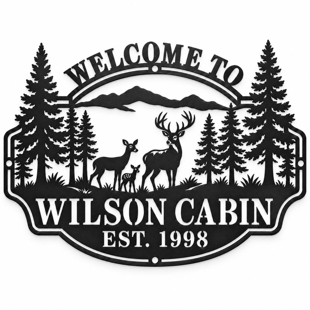 Black personalized Wilson Cabin metal sign with a deer family, pine trees, mountains, and EST. 1998 on a white background.