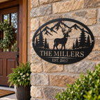 Custom deer family metal sign mounted on a rustic stone wall with side holes at a home entrance.