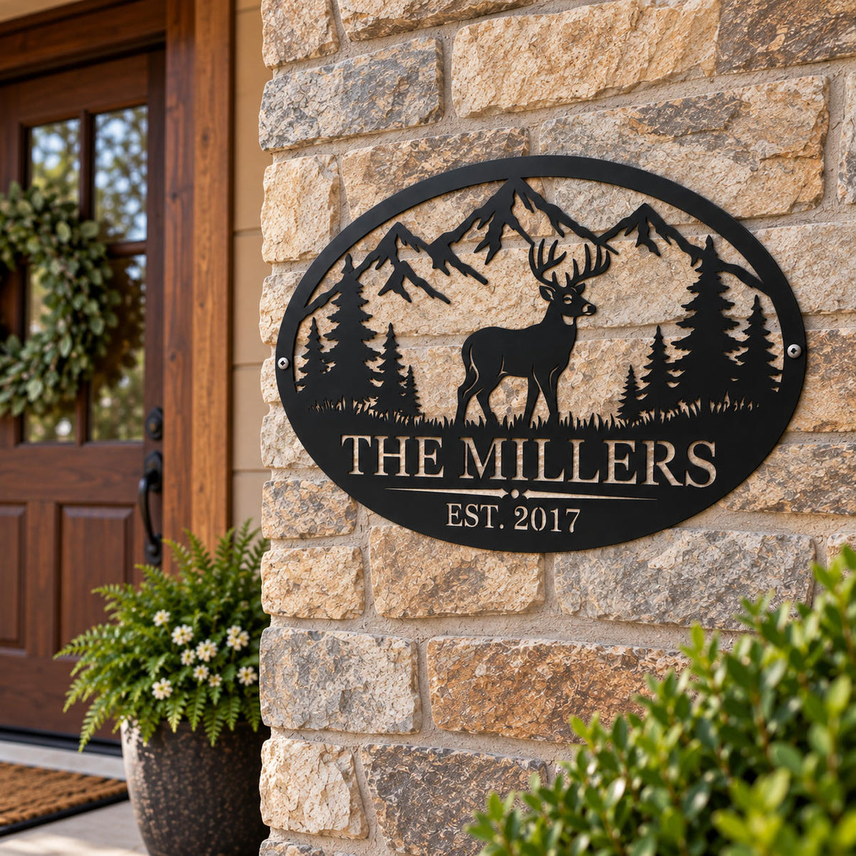 Custom deer family metal sign mounted on a rustic stone wall with side holes at a home entrance.