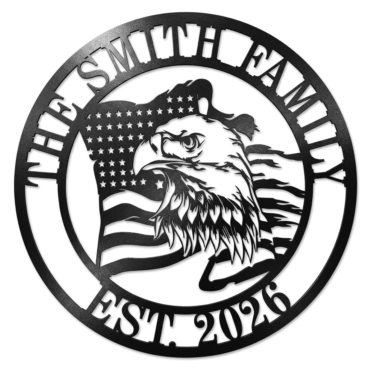 A matte black laser-cut circular metal art monogram, made of heavy-duty 14-gauge steel, featuring a majestic bald eagle profile and waving American flag. The top arc reads "THE SMITH FAMILY" and the bottom arc reads "EST. 2026", both cut-out text. This is an example of a customizable family name sign. Main image