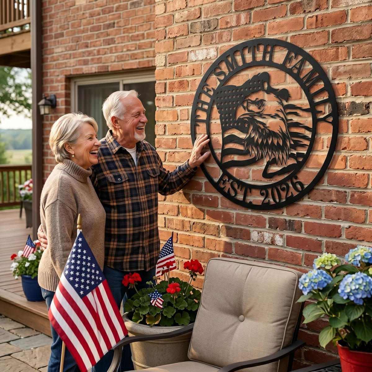 A matte black laser-cut circular metal art monogram, made of heavy-duty 14-gauge steel, featuring a majestic bald eagle profile and waving American flag. The top arc reads "THE SMITH FAMILY" and the bottom arc reads "EST. 2026", both cut-out text. This is an example of a customizable family name sign.