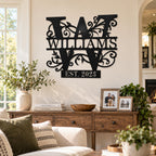 Custom Williams family name metal sign with floral monogram displayed on a warm living room wall.