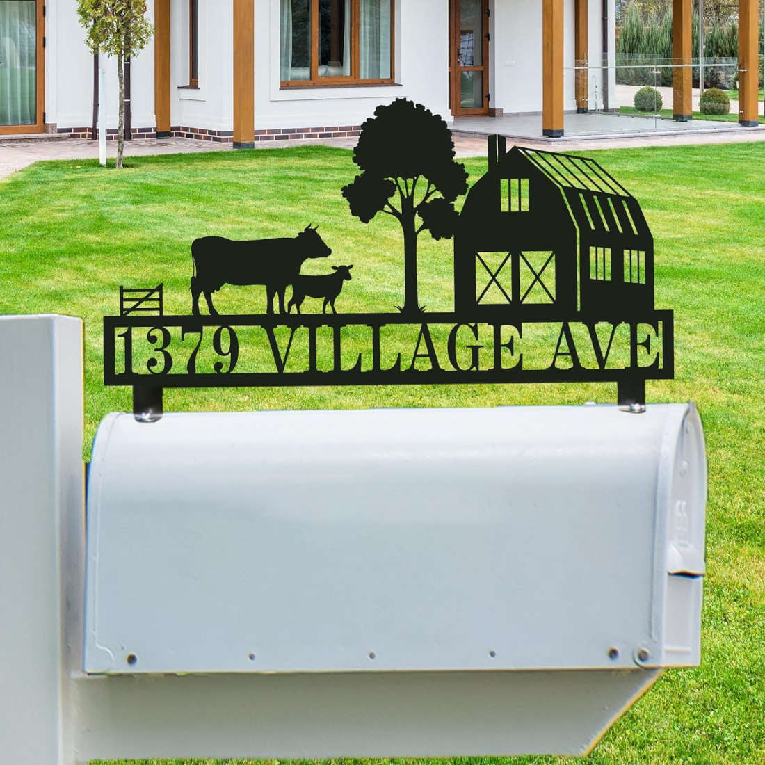 Customized stainless steel farmhouse mailbox topper with laser-cut barn, cow, and sheep silhouette, featuring black powder-coated personalized address text.
