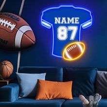 Custom football jersey neon sign with personalized name and number, blue LED jersey and glowing football.