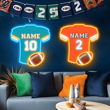 Custom football jersey neon sign with personalized name and number, blue LED jersey and glowing football.