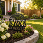 Personalized pet memorial metal sign displayed in a landscaped front yard flower bed