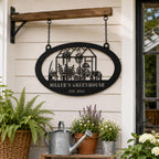 Custom greenhouse metal sign hanging by chains on a garden porch surrounded by potted plants and gardening decor.
