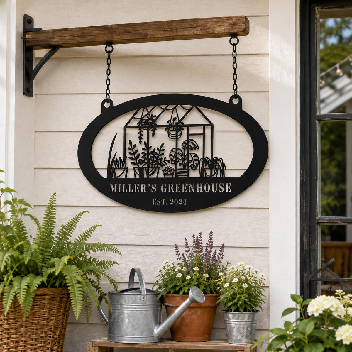 Custom greenhouse metal sign hanging by chains on a garden porch surrounded by potted plants and gardening decor.