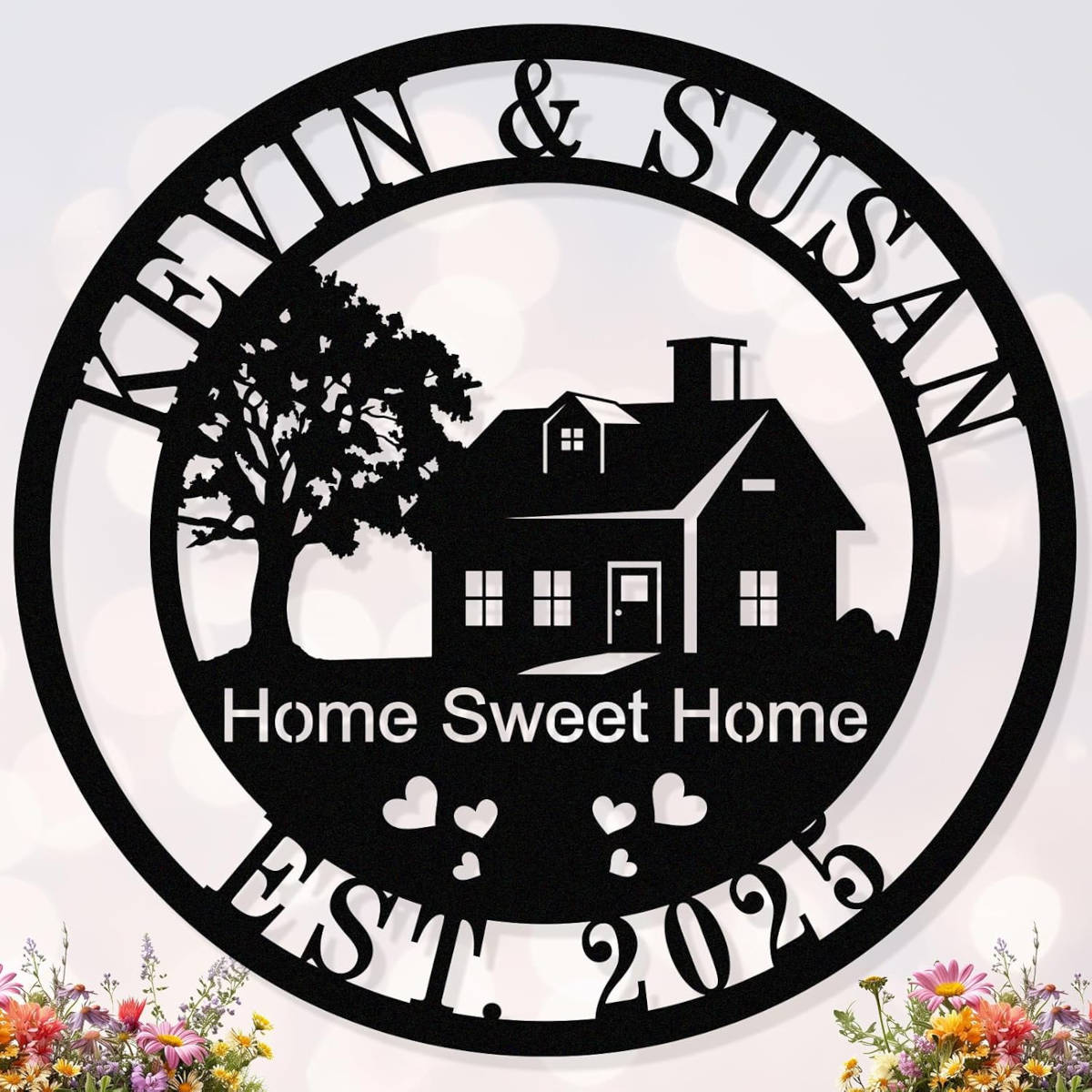A custom metal sign with a silhouette of a house and tree, featuring the text 'Home Sweet Home' and the names 'KEVIN & SUSAN EST. 2023'.