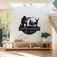 Personalized hunter metal sign showing kneeling man with rifle aiming at deer, rustic wall decor for hunting cabin or man cave, custom text and year, powder-coated steel design.
