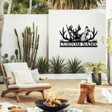 Customizable black metal sign featuring a laser-cut design with a buck and a doe, rifle, bow, and antlers, with 