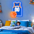 Custom basketball jersey neon sign with personalized name and number in bright LED lights.