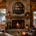 Personalized metal lake scene sign displayed above a rustic stone fireplace in a cozy cabin living room.