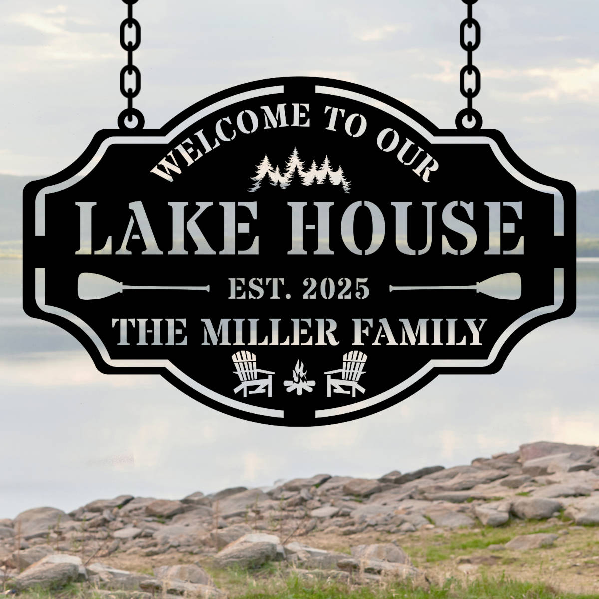 Custom metal lake house sign with family name, trees, paddles, and chairs design, black powder-coated steel, personalized outdoor cabin wall decor. Main image