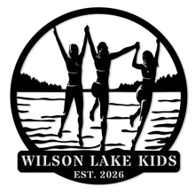 Custom lake kids metal sign featuring children silhouette design, personalized family name and year, round steel wall decor for lake house or cabin