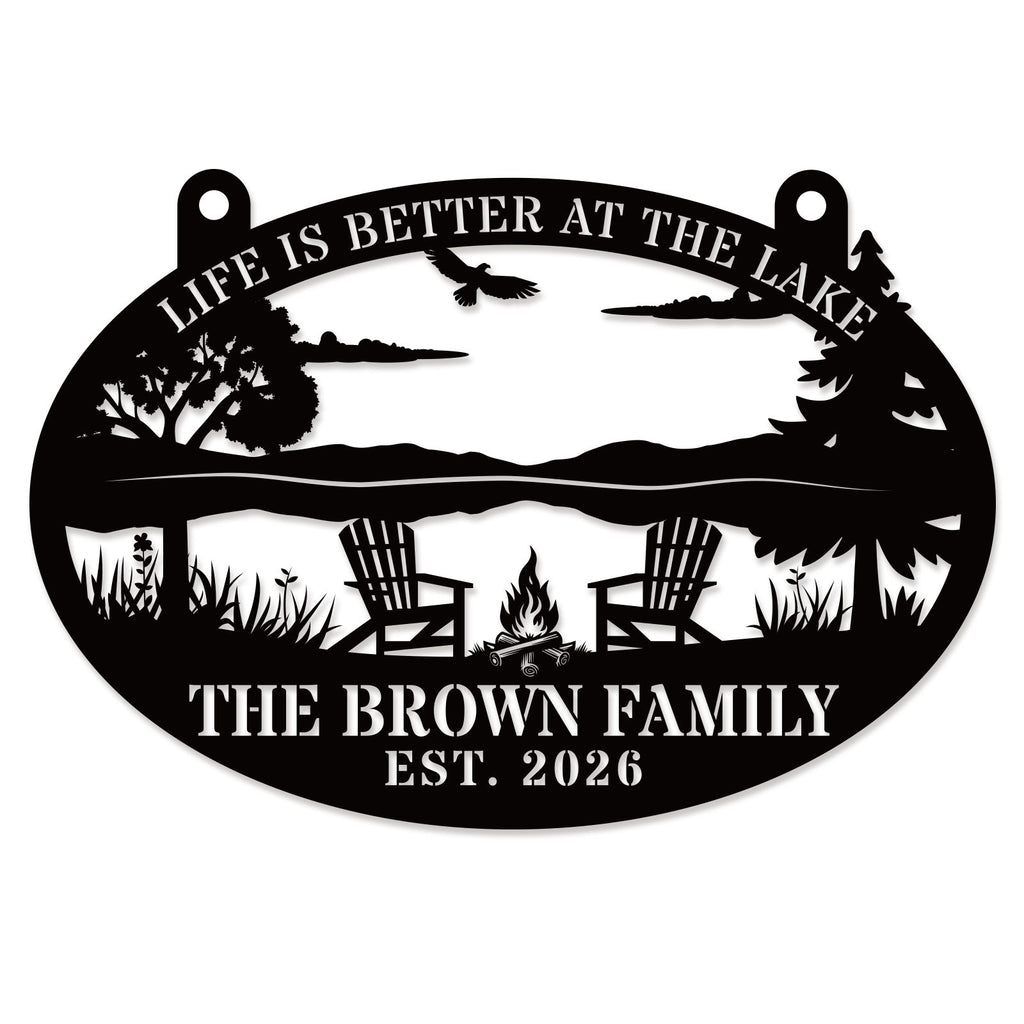 Black laser-cut steel oval lake sign reading "Life is Better at the Lake" with soaring eagle, lake scene, Adirondack chairs, campfire, and pine trees, personalized with "The Brown Family" and EST 2026 — custom lake house metal wall art