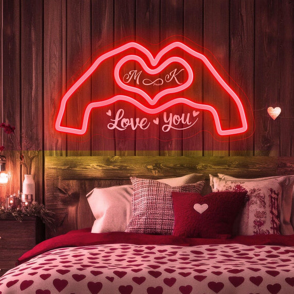 Custom love neon sign with personalized initials inside heart hands design, pink LED neon wall light for romantic bedroom or wedding decor