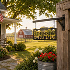 Custom farmhouse metal sign hanging from chains on a rustic front porch.