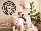 arge personalized black metal wall clock with custom names James and Sofia established 2023, featuring Roman numerals and gold hands for indoor home decor.