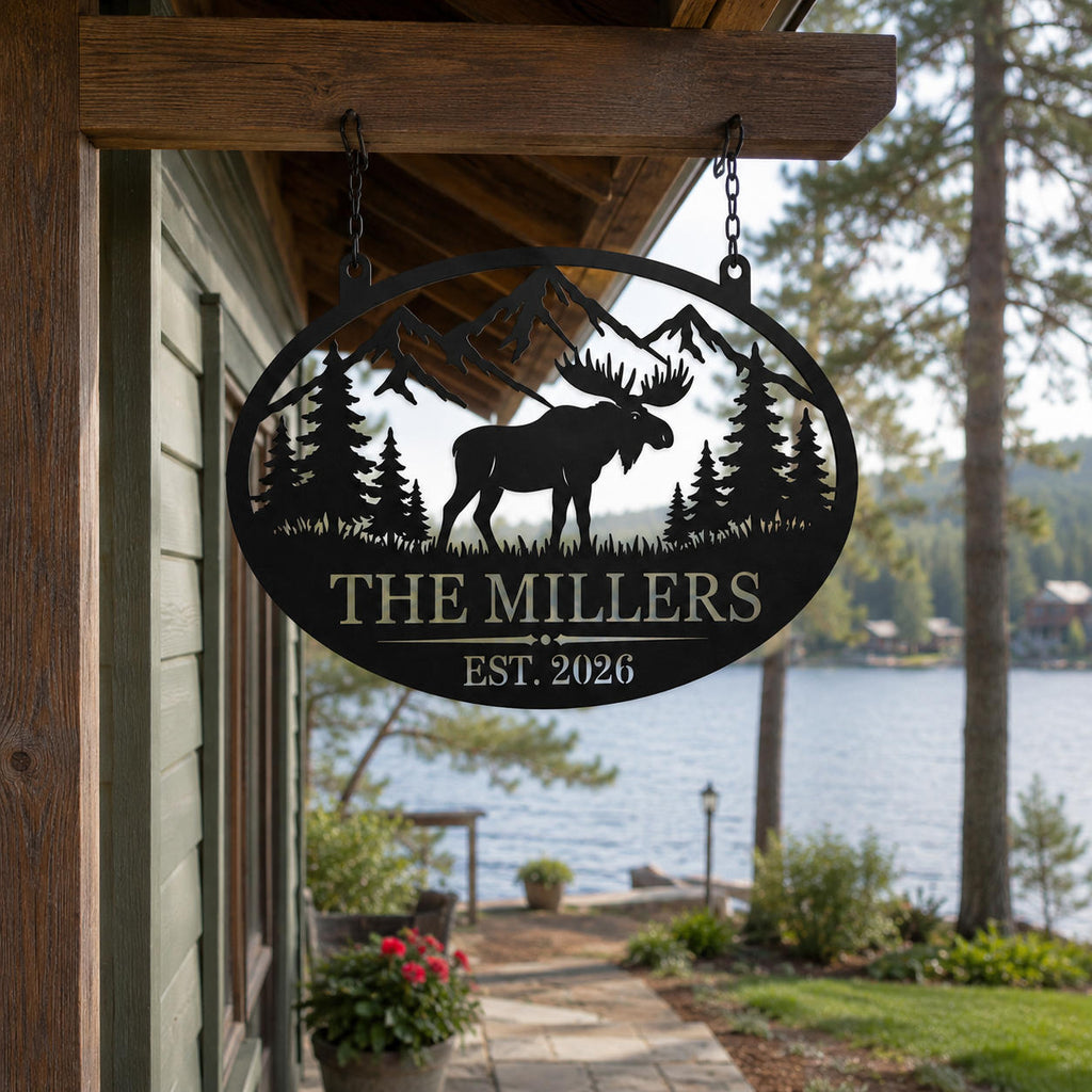 Custom moose family metal sign hanging from a rustic lake house porch overlooking the water.