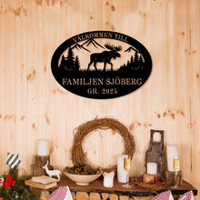 Custom moose metal sign with personalized text, laser-cut steel wall art featuring moose, mountains, and trees, powder coated finish for rustic cabin and lodge décor.