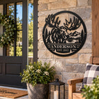 Custom Anderson moose metal wall art mounted on a rustic stone porch beside a welcoming home entrance.