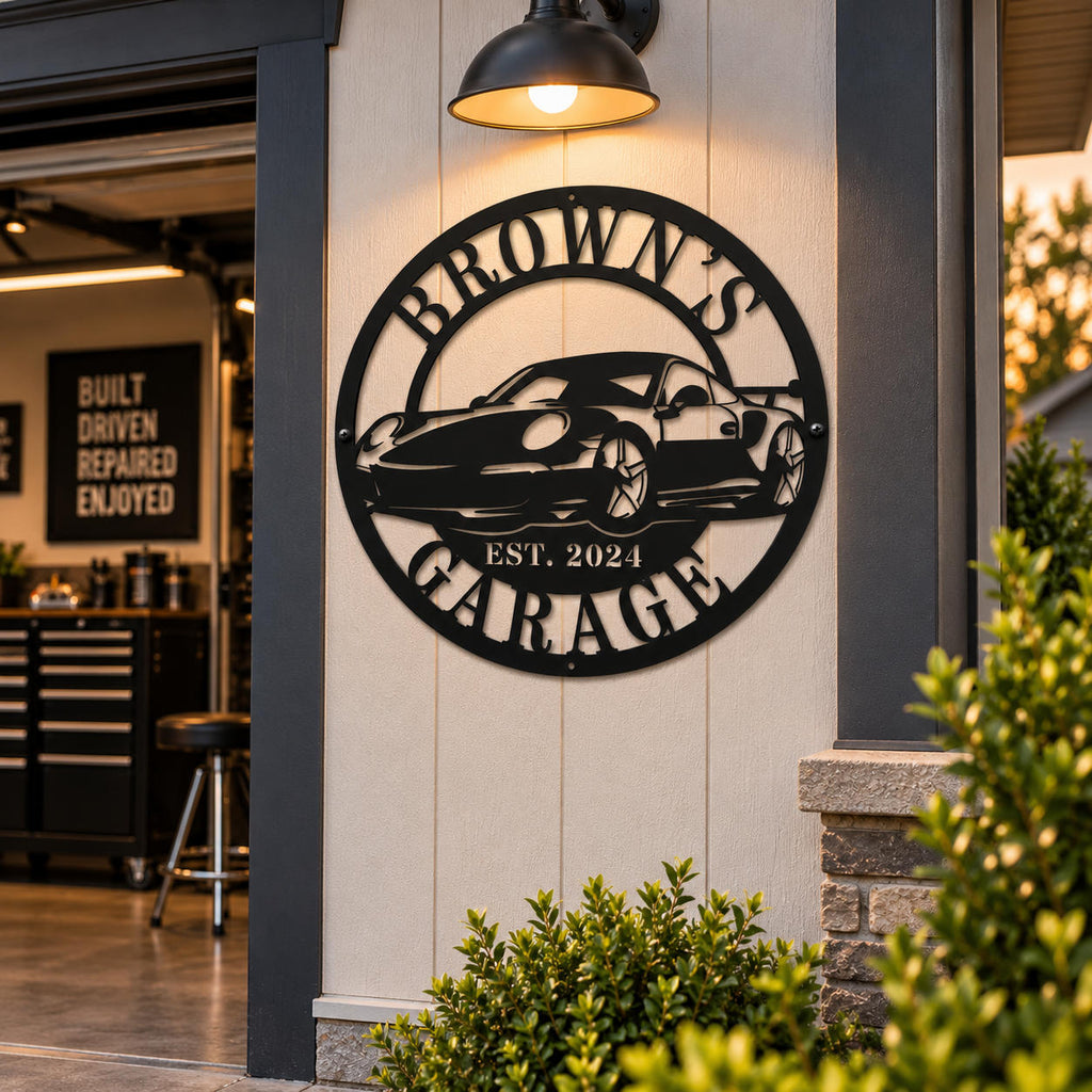 Custom Brown's Motorsports metal sign with sports car design displayed on an outdoor garage wall.