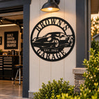Custom Brown's Motorsports metal sign with sports car design displayed on an outdoor garage wall.