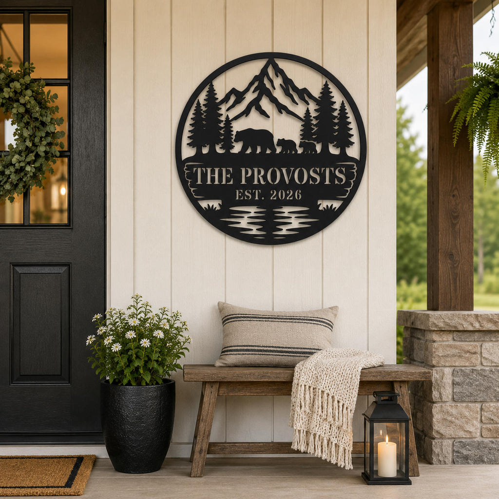 Personalized mountain and bear family metal sign displayed on a welcoming farmhouse-style porch.