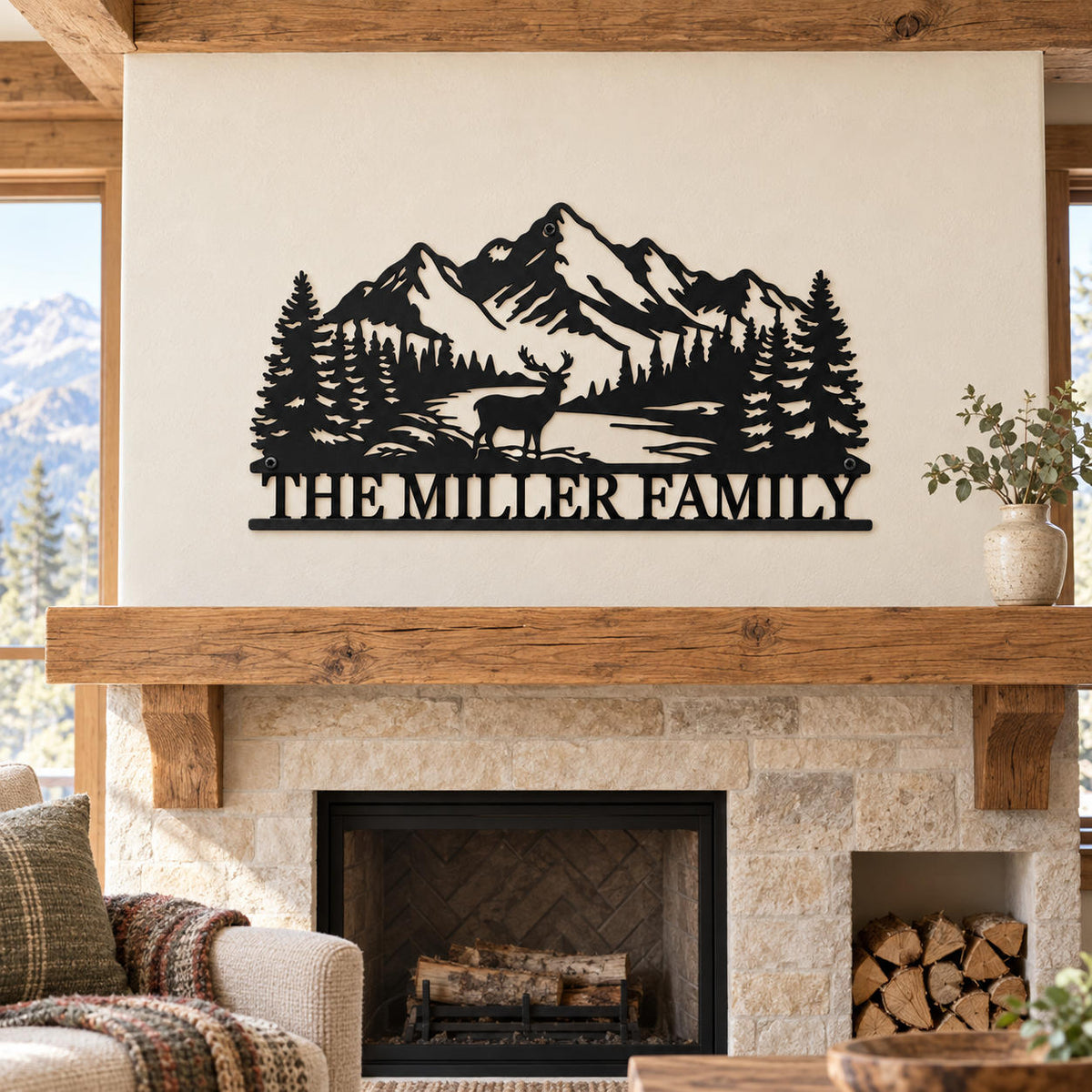 Black mountain and deer family sign displayed above a rustic wood mantel and stone fireplace.