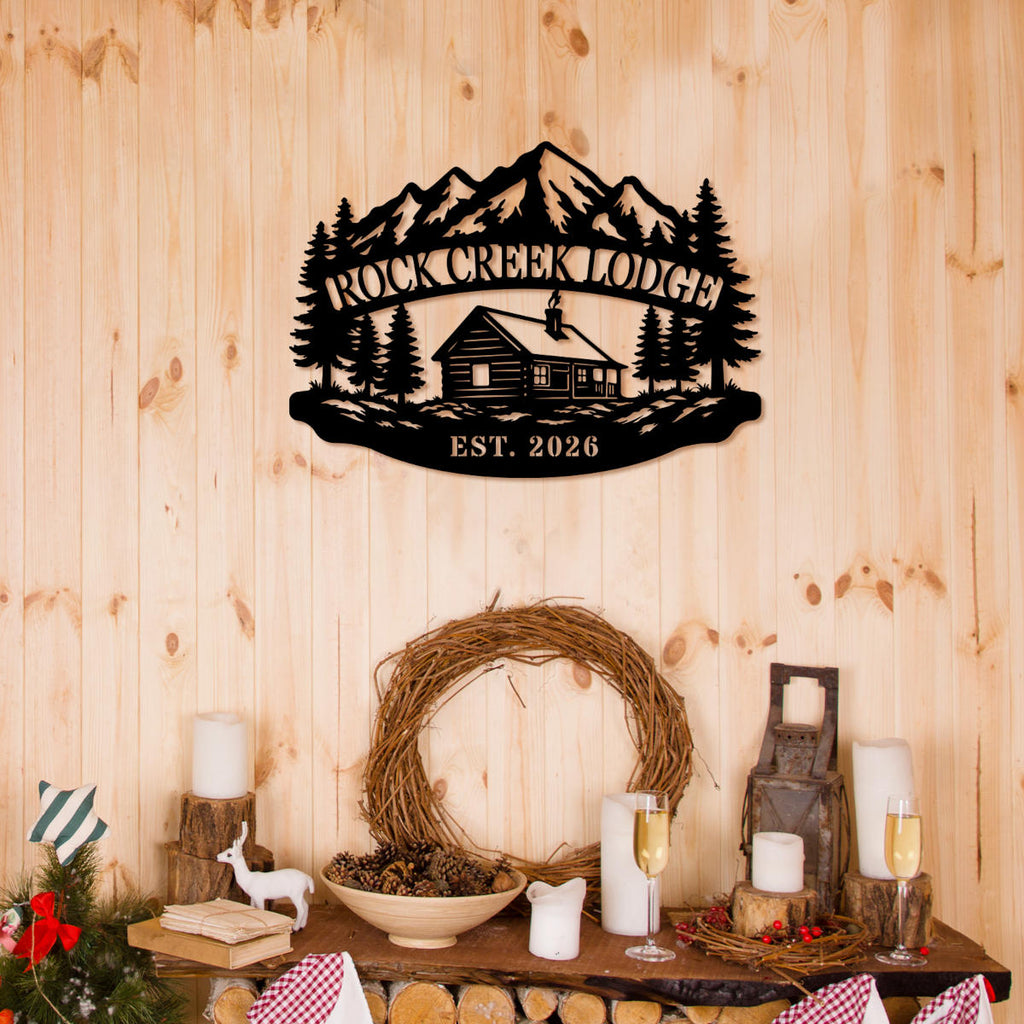 Custom mountain lodge metal sign featuring a cabin, pine trees, alpine mountains, and personalized lodge name with established year