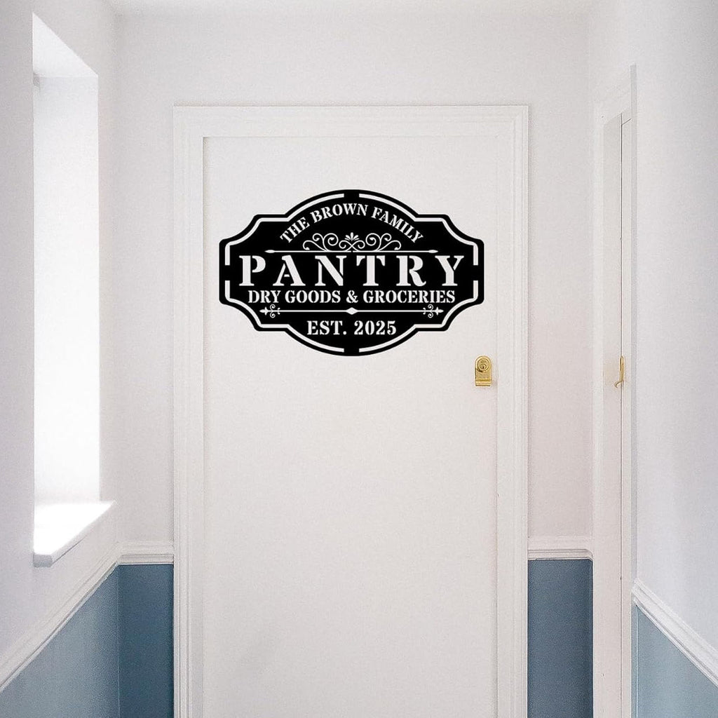 Custom black steel pantry sign with personalized text "The Brown Family Pantry Dry Goods & Groceries EST. 2025" with decorative vintage style