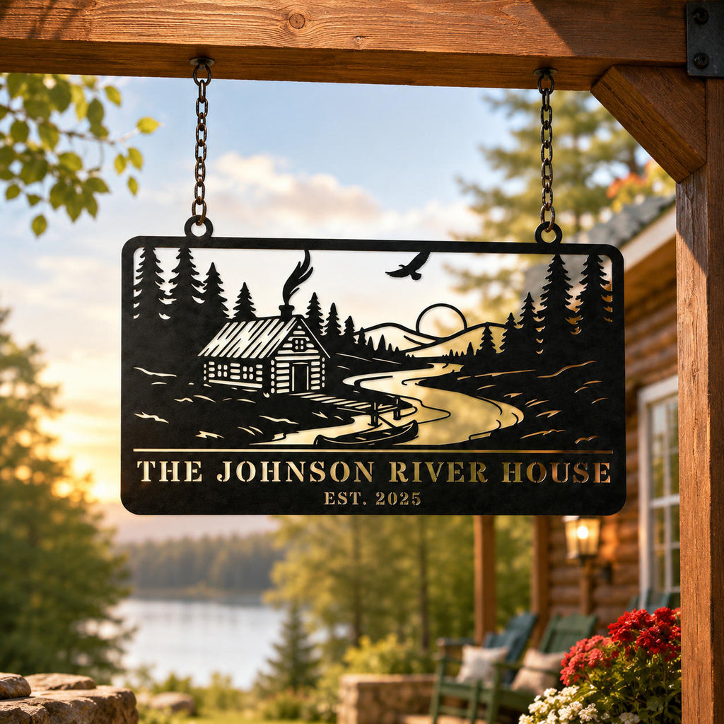 Personalized river house metal sign suspended with metal chains on a lakeside cabin porch, featuring a custom family name and scenic woodland design.