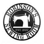 Round personalized sewing room metal sign with a vintage sewing machine silhouette and custom family name.