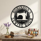Round personalized sewing room metal sign with a vintage sewing machine silhouette and custom family name.