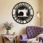 Round personalized sewing room metal sign with a vintage sewing machine silhouette and custom family name.