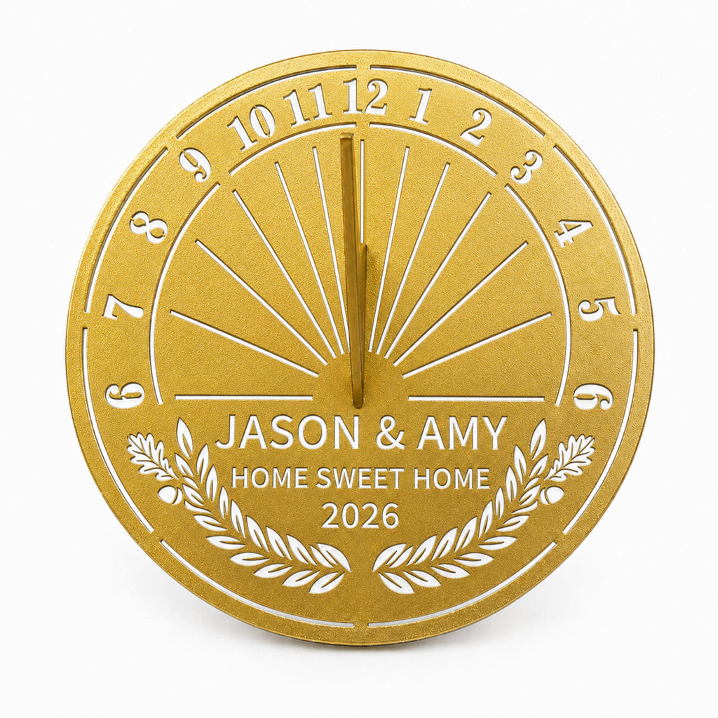 Custom stainless steel housewarming garden sundial in gold finish with personalized family names, custom message and year on a white background.