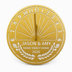 Custom stainless steel housewarming garden sundial in gold finish with personalized family names, custom message and year on a white background.
