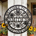 Custom round metal family name sign featuring laser-cut sunflowers and "Where Love Grows" text.