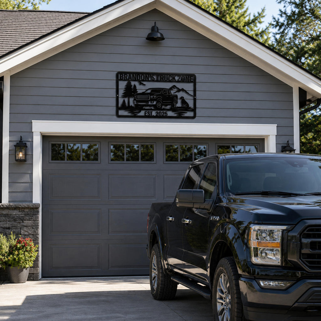 Custom truck metal sign mounted above a garage door with personalized name and pickup truck design on a modern American home.