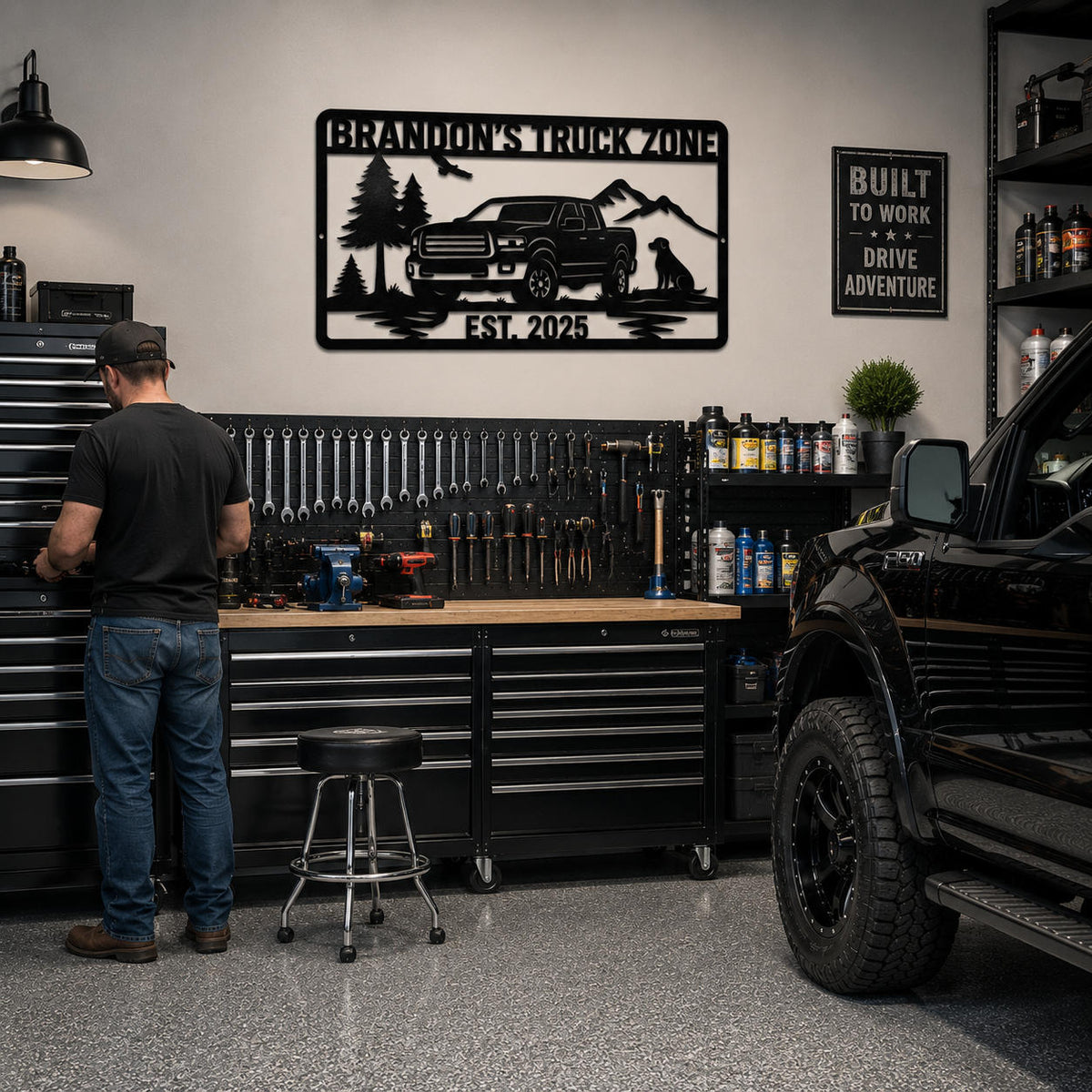 Personalized truck zone metal sign displayed inside a professional garage workshop with pickup truck and tool storage.