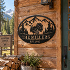 Custom turkey metal sign mounted on a rustic hunting cabin with mountain, pine tree, family name and established year design.