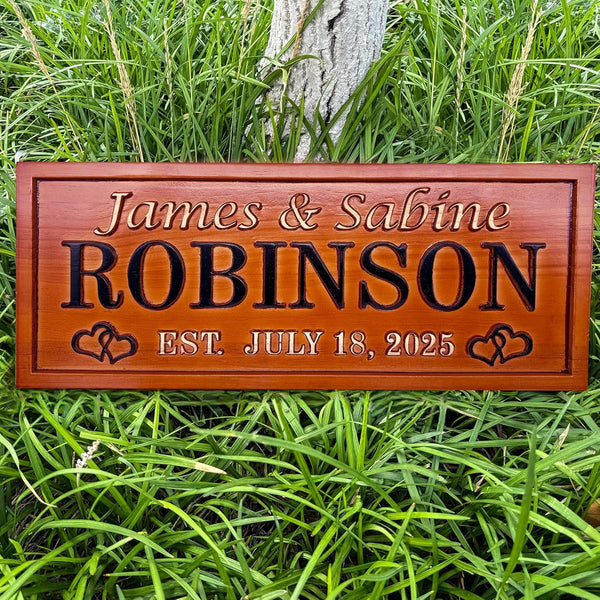 Engraved wooden name sign made from pine, featuring custom names and dates. Single-color finish with heart design. Great gift for weddings or anniversaries.