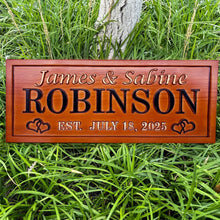 Engraved wooden name sign made from pine, featuring custom names and dates. Single-color finish with heart design. Great gift for weddings or anniversaries.